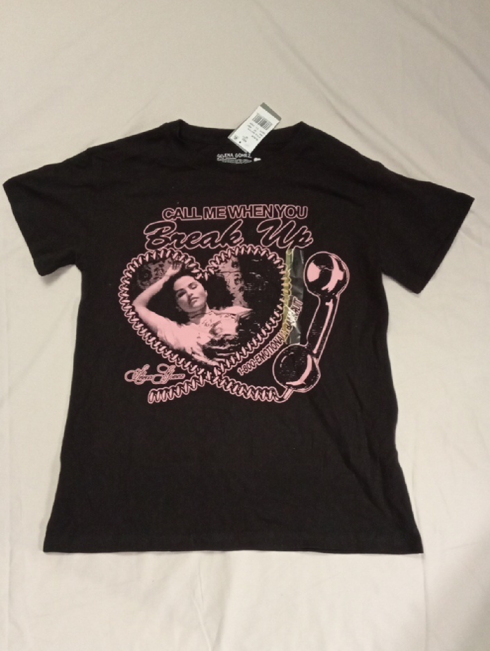 Selena Gomez Black T‑Shirt with Pink Heart Detail